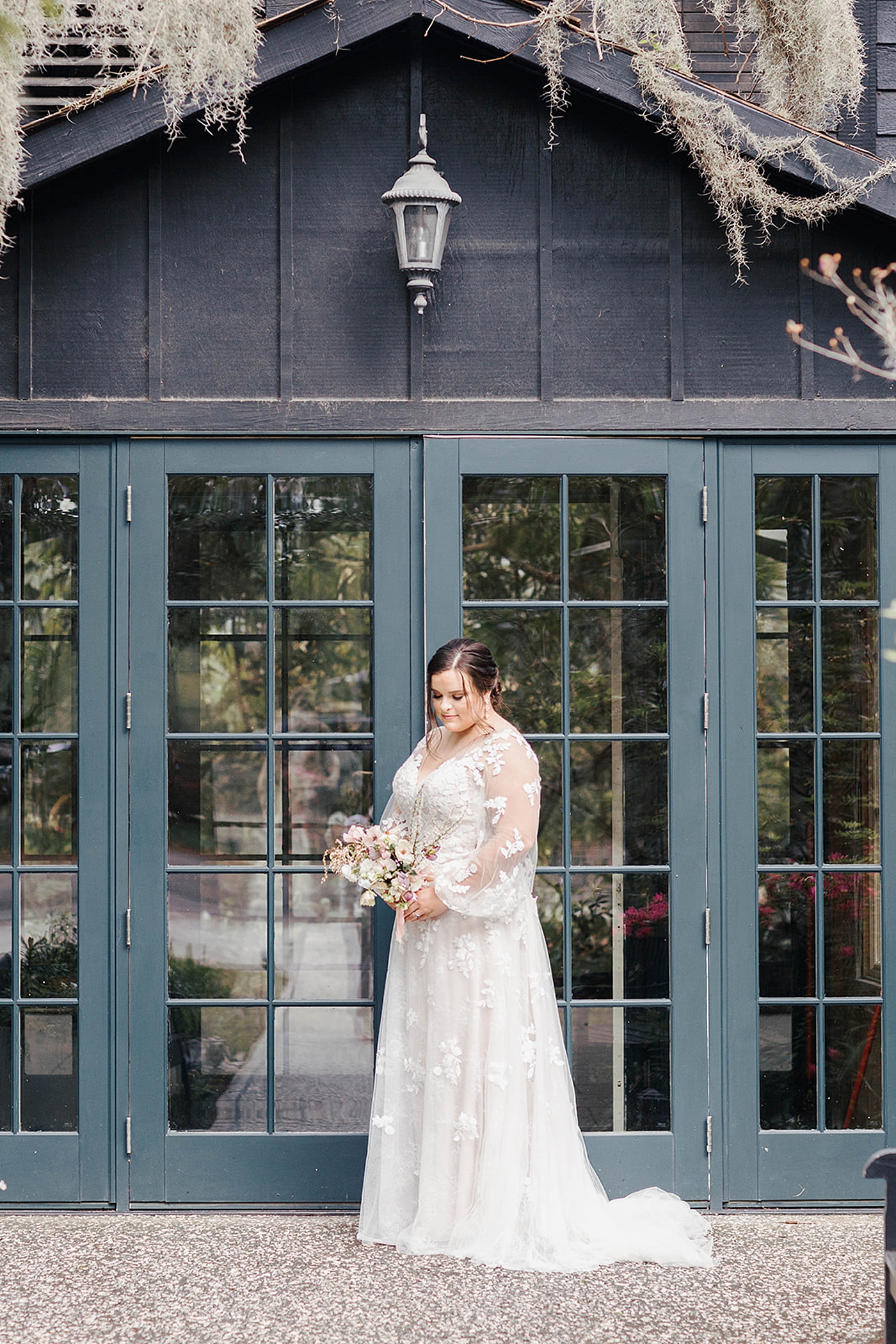 Bride standing outside a greenhouse | Carters Event Co