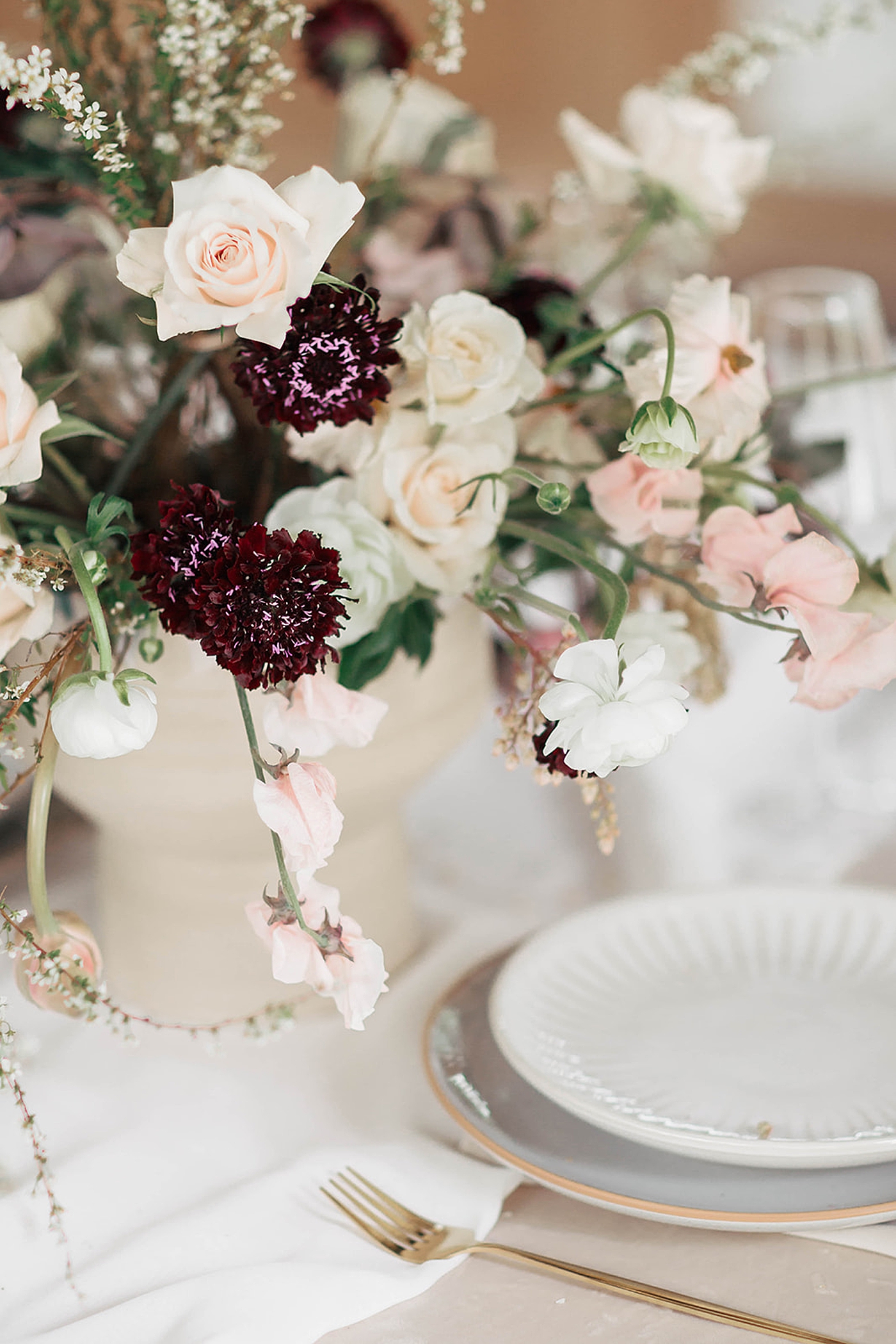 Assortment of wedding flowers on a table | Romantic French Countryside Editorial by Carters Event Co