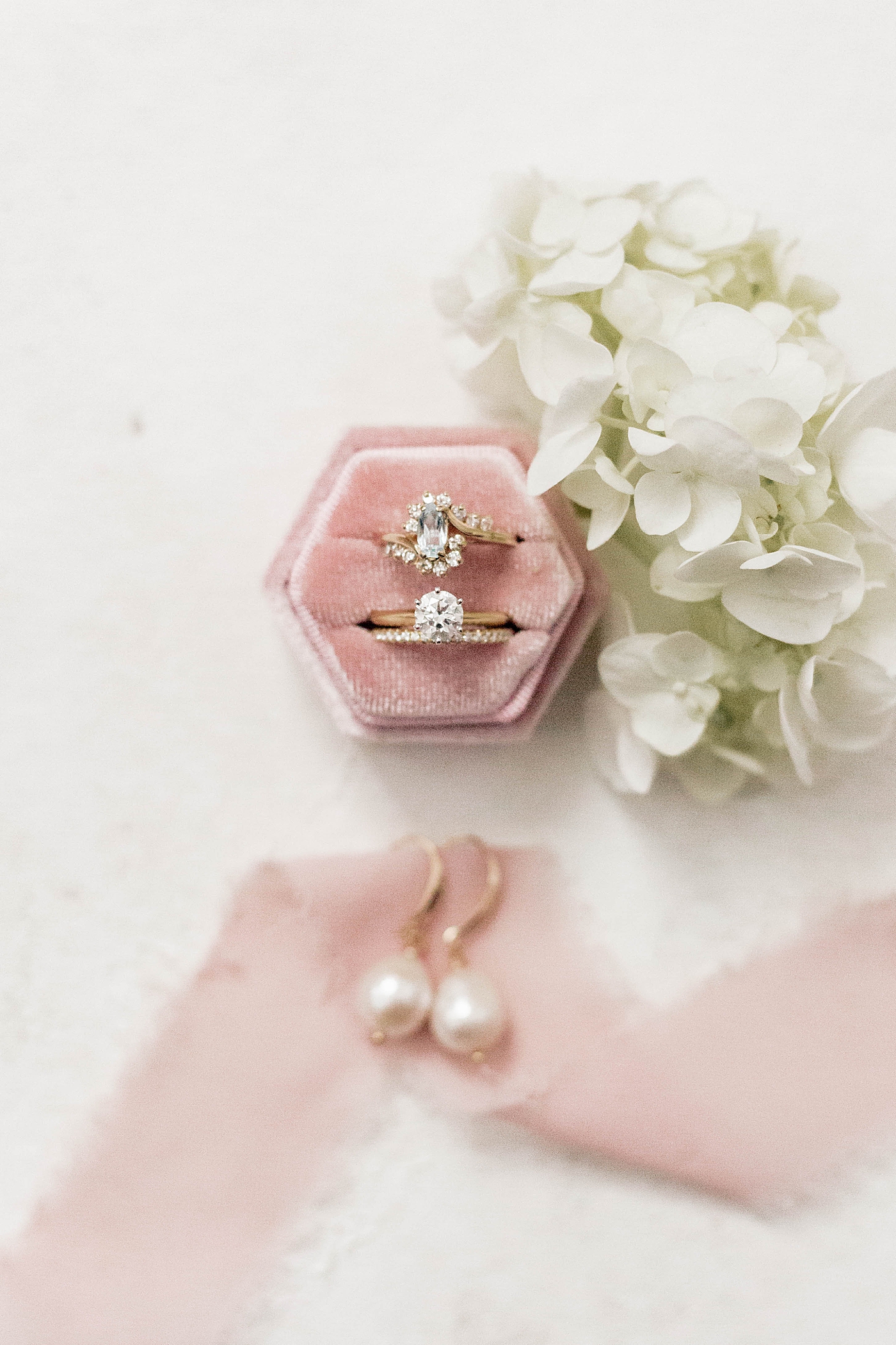 Pink ring box with ribbon and white florals | Carters Event Co