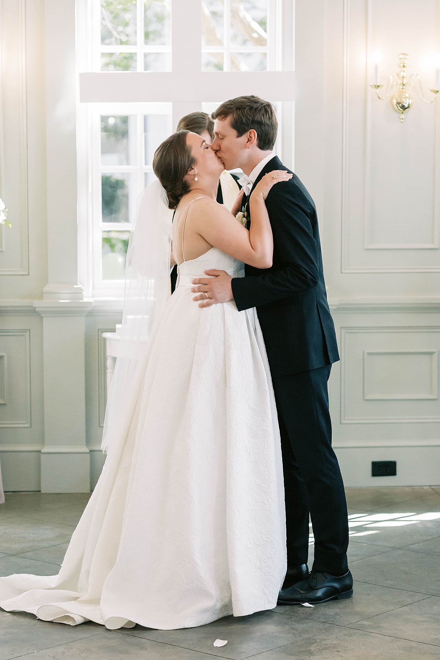 Bride and groom first kiss during their Intimate spring wedding | Carters Event Co
