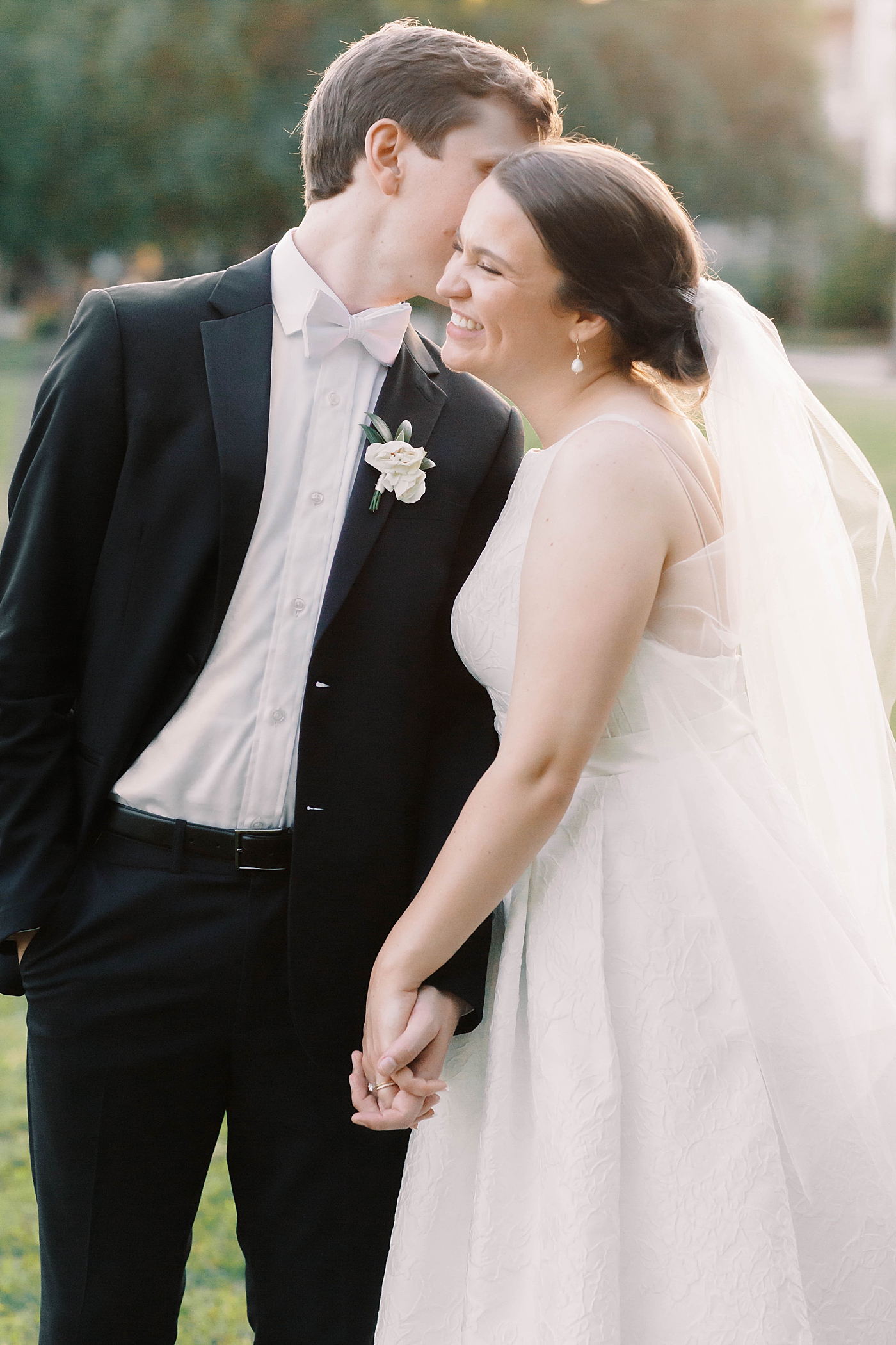 Bride and groom laughing during couple portraits | Carters Event Co