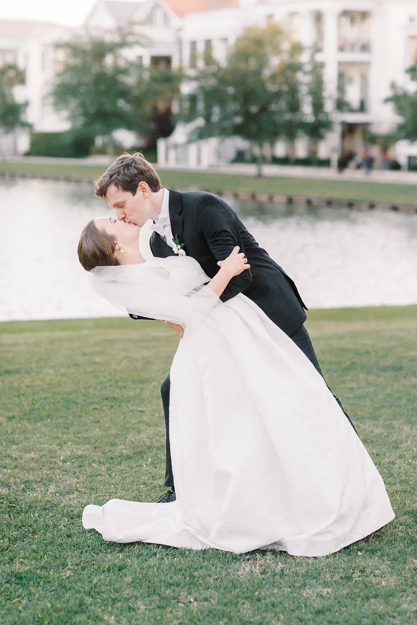 Bride and groom kiss during their Intimate spring wedding | Carters Event Co