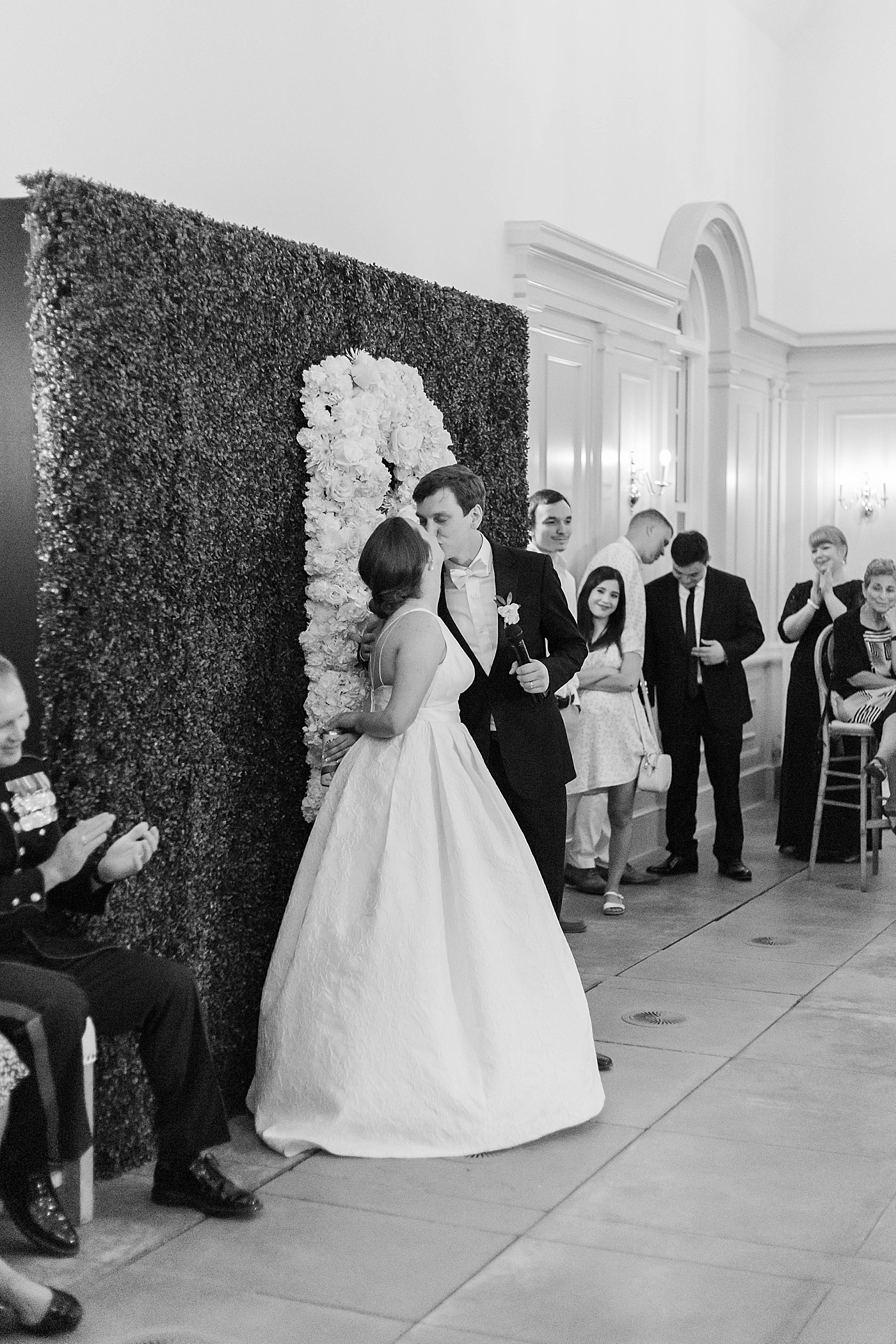 Black and white image of bride and groom kissing during their Intimate spring wedding | Carters Event Co