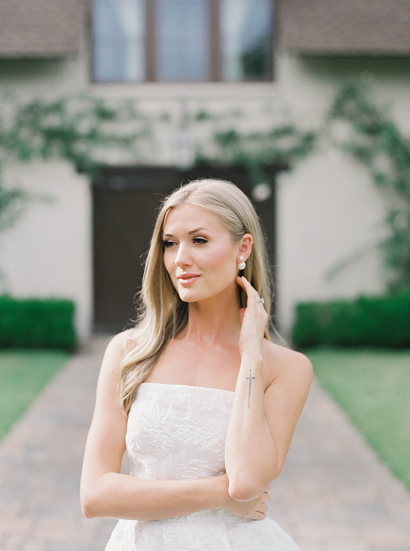 Bride posing for portraits in white gown | Carters Event Co