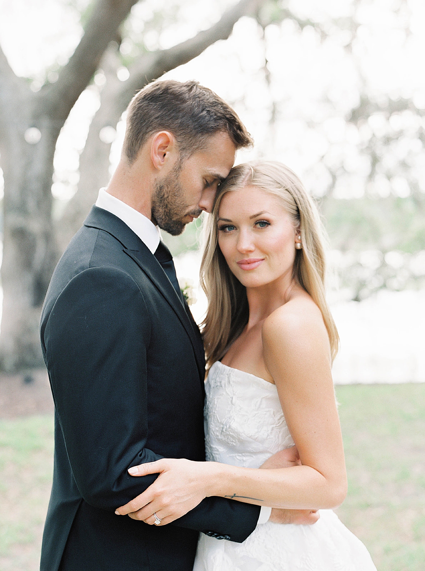 Bride and groom embracing during portraits | Carters Event Co
