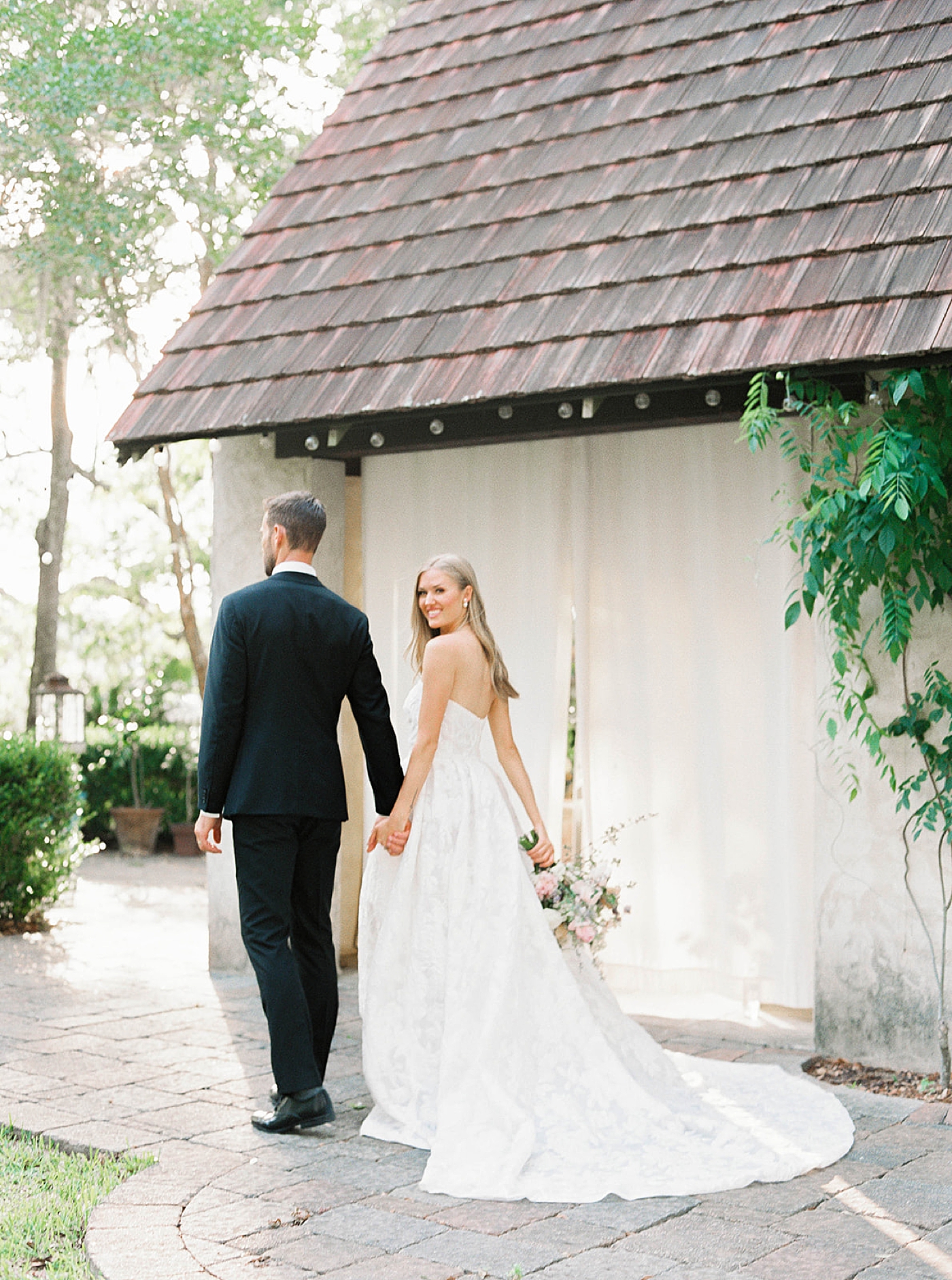 Bride and groom walking away from their reception | Carters Event Co