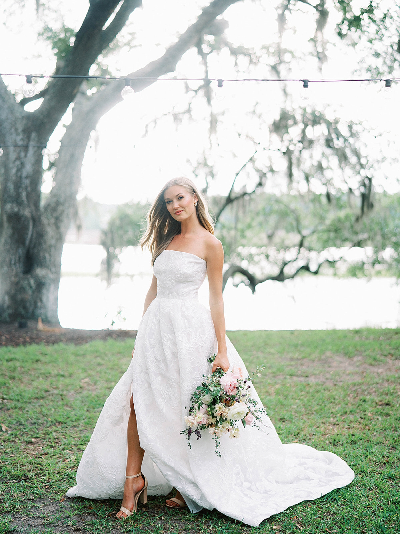 Bride holding a bouquet walking | Charleston Photography Workshop with Carters Event Co